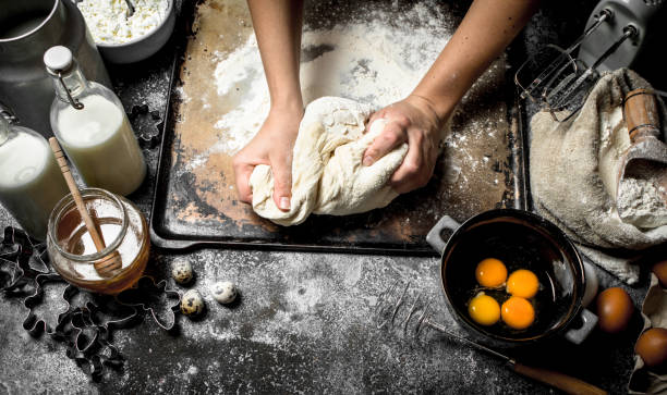 istock Dough background. Preparation of the dough from fresh ingredients. 903249804