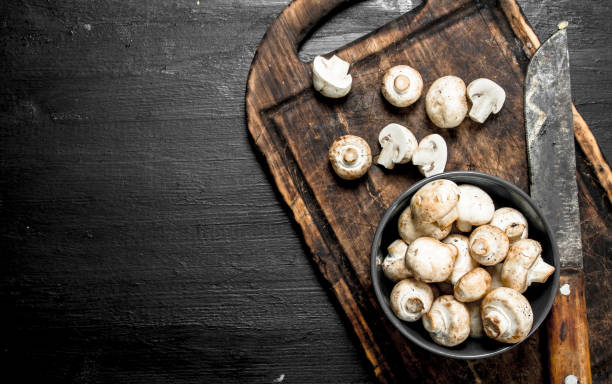 istock Fresh mushrooms on the board. 903249940