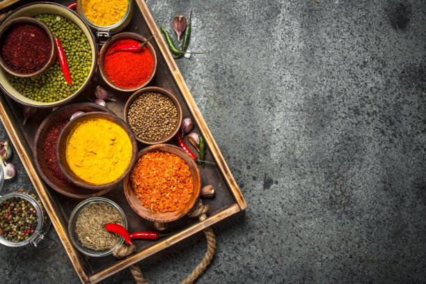 istock Ground spices in bowls on a wooden tray. 903250230