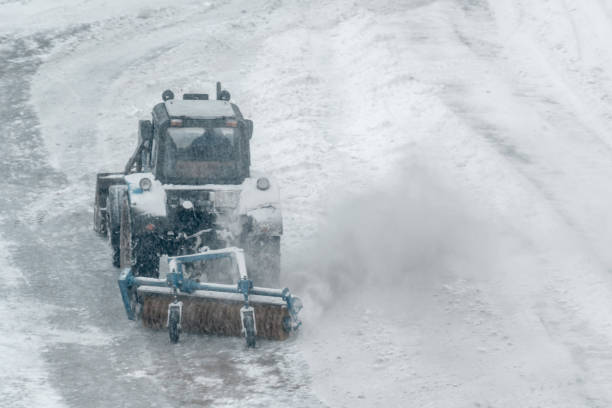 istock Tractor Removes Snow on Ice Rink 903251506