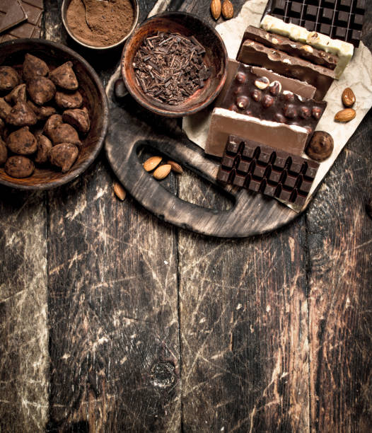 istock Chocolate bars with truffles and cocoa powder. 903257020