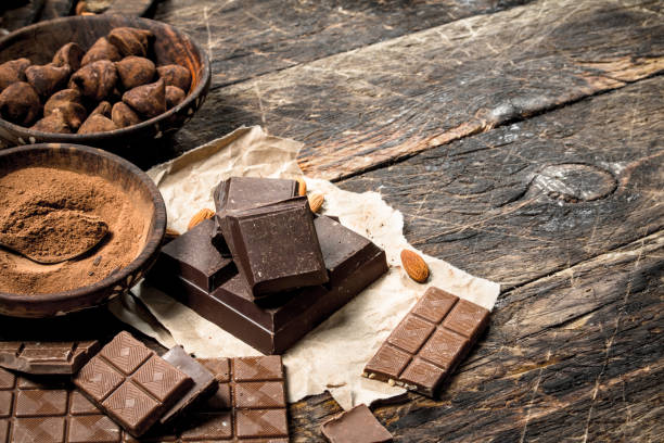 istock Chocolate bars with truffles and cocoa powder. 903257224