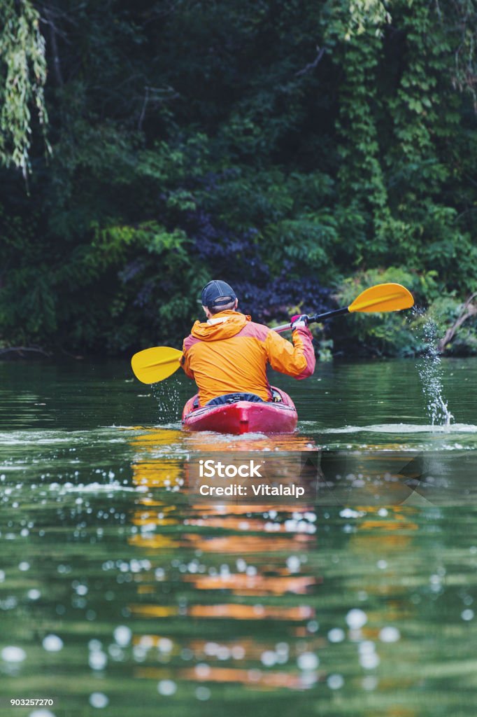 Kayak Water Sports Banner with Copy Space. Senior Kayaker on the Scenic Lake Panoramic Photo. Outdoor Pursuit Stock Photo