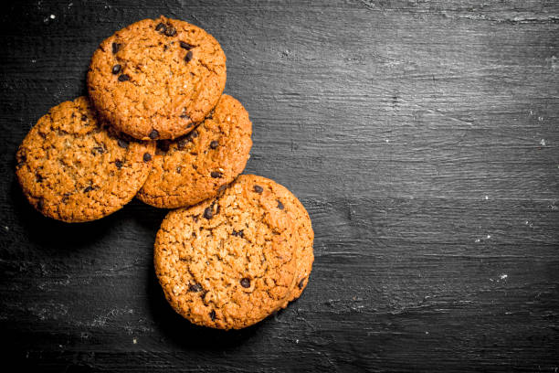 istock Oat cookies. On Black chalkboard. 903258238