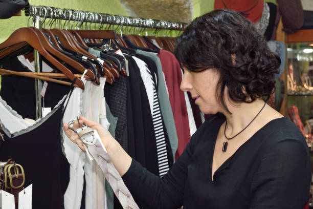 istock Woman buying clothes in a bazaar 903264524