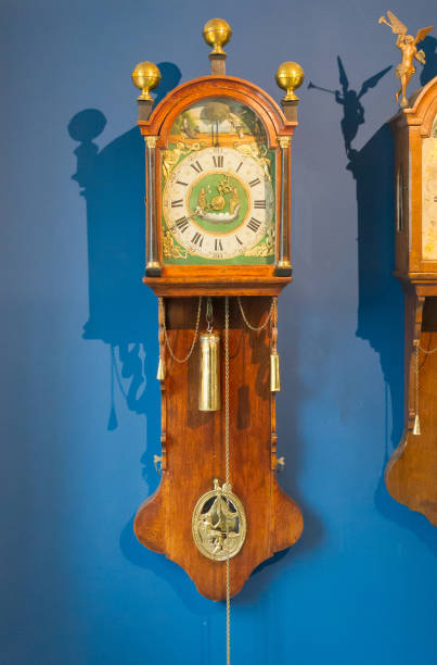 istock Brass weight on an old dutch clock 903264570
