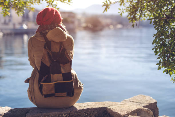 istock Lonely woman on sea shore 903264822