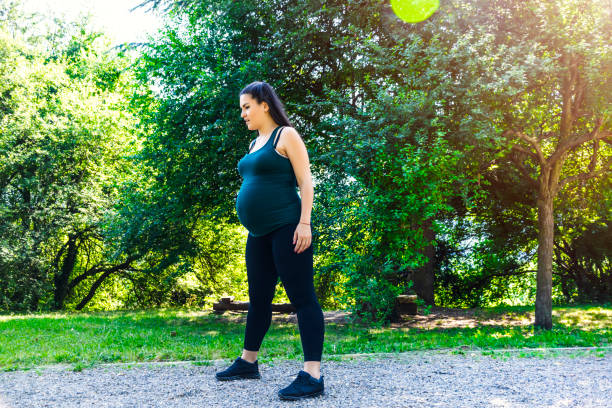 istock Pregnant woman exercising 903264948