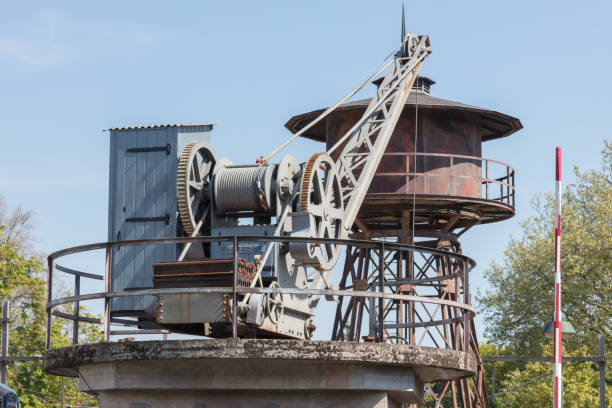 Old water tower and crane at a railway station - Not in use anymore