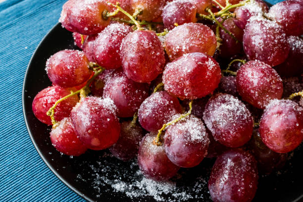 Sugared Sangria Purple Grapes for Dessert. Sugared Sangria Purple Grapes for Dessert. Organic Food. frozen grapes stock pictures, royalty-free photos & images