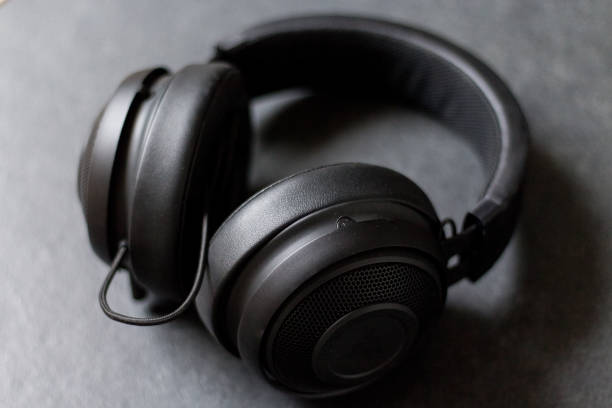 istock Black Headphones on Dark Background 903273068