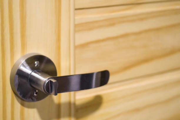 istock Handle lever-style door knobs on the doors of pine 903274314