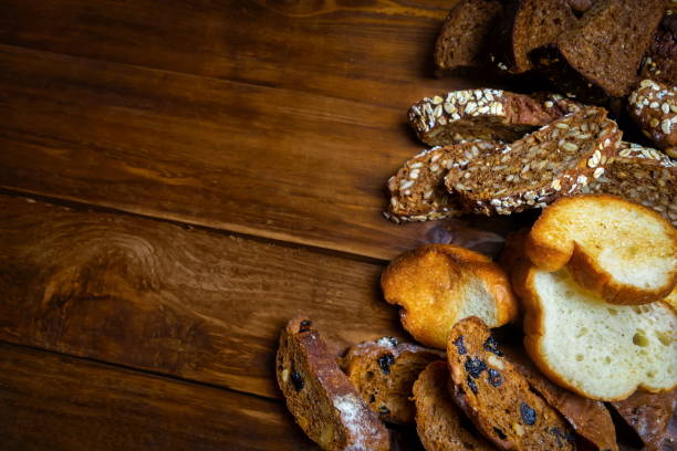 istock Assortment of baked bread on wooden table background 903276894