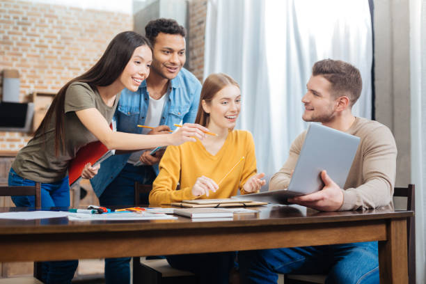 istock Excited students looking at the screen of a laptop and being surprised 903280578