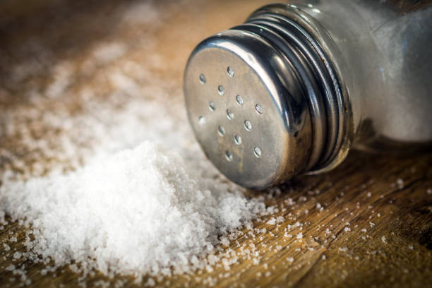 istock Salt on wooden background 903280852