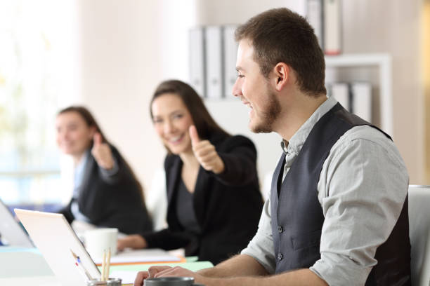 istock Proud employee being congratulated by colleagues 903282158