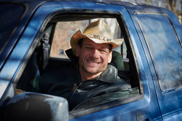 istock Man in his pick-up truck 903286094