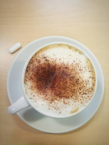 Morning coffee cappucino with pill medication breakfast