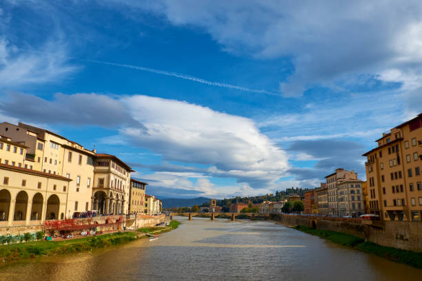 Florence, Italy - November 15 2017 : The colorful stucco villas, palazzo, luxury stores and hotels overlooking the River Arno in central Florence, Tuscany, Italy