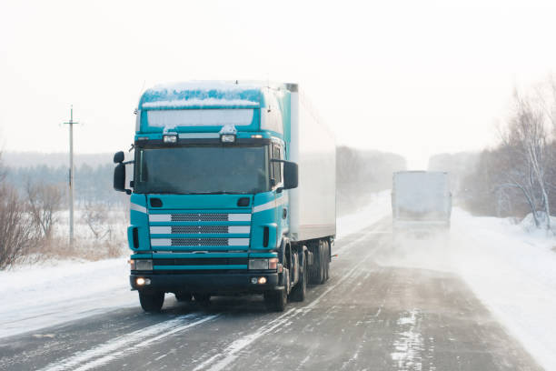 istock Truck on winter road 903289624