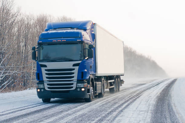 istock Blue truck on a winter road 903289626