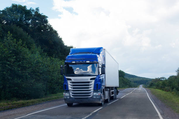 istock Blue truck on a road 903289648