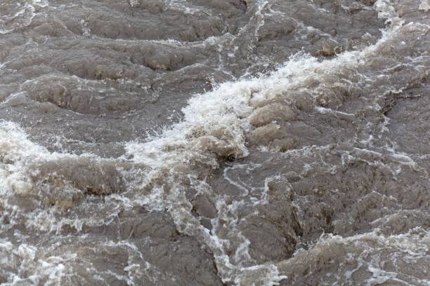 istock Turbulent brown and dirty water 903290644