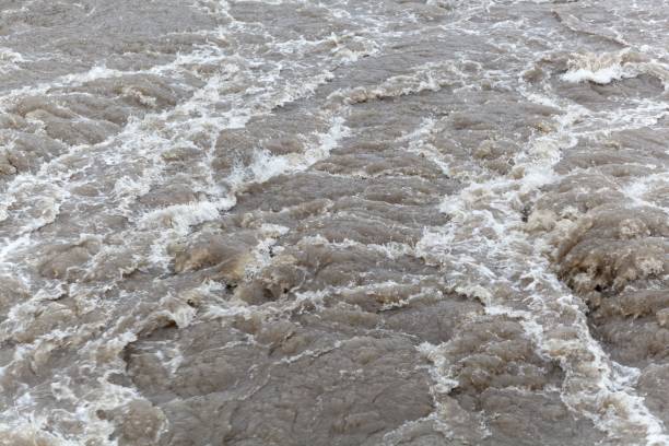 istock Turbulent brown and dirty water 903292464