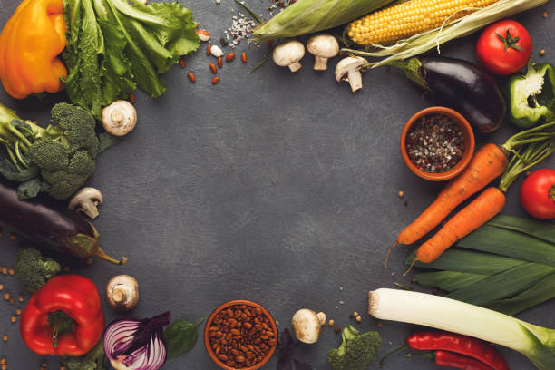 istock Frame of fresh vegetables on wooden background with copy space 903293870
