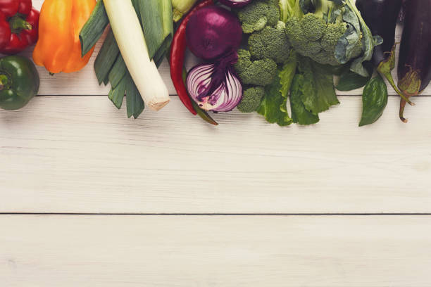 istock Border of fresh vegetables on wooden background with copy space 903294332