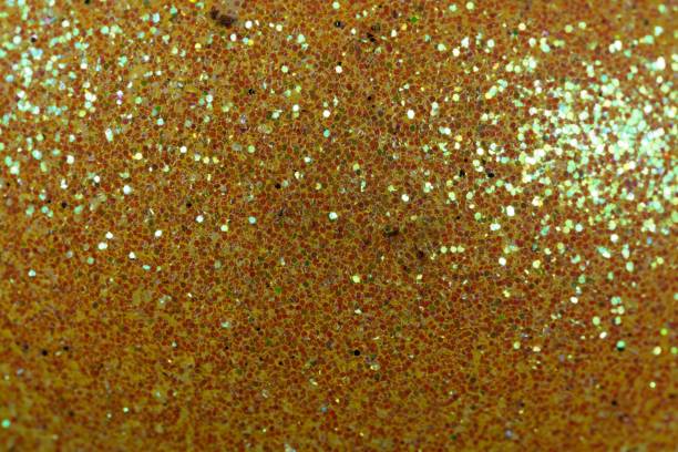 istock Glitter background made of small red fragments 903297090