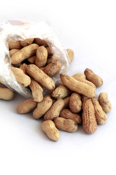 istock group of dried peanuts with plastic bag 903297114