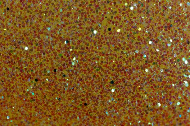 istock Glitter background made of small red fragments 903297188
