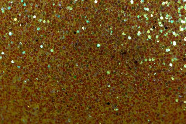 istock Glitter background made of small red fragments 903297226