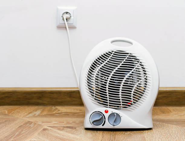 istock Electric fan heater at home. 903297664