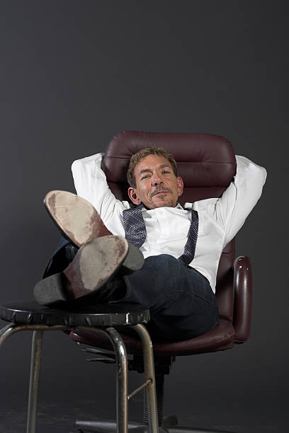 istock Businessman relaxing in chair 90330379