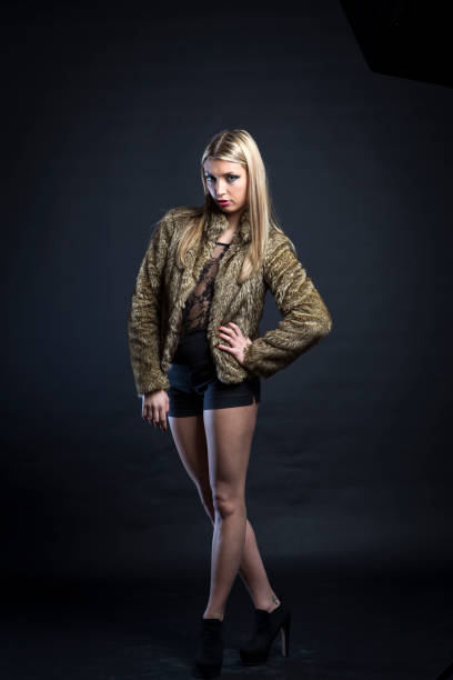 Blonde girl with a fur coat