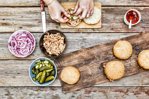 istock cooking burgers. the process of making home-burger. 903306472