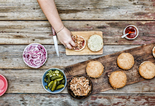 istock Burger burgers and burger ingredients on a wooden kitchen table 903306734