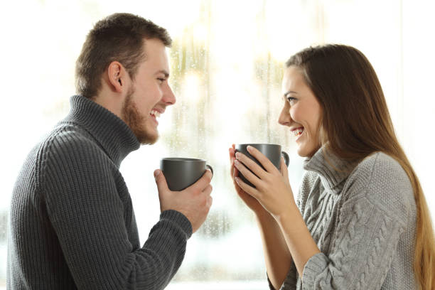 istock Couple in love looking each other in winter 903309828
