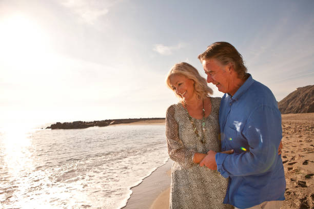 istock Happy couple on beach 6 903310402
