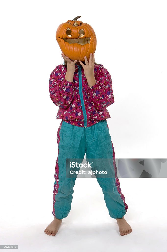Old Pumpkin A Young girl holds up an old Jack-o-lantern Carving - Craft Product Stock Photo