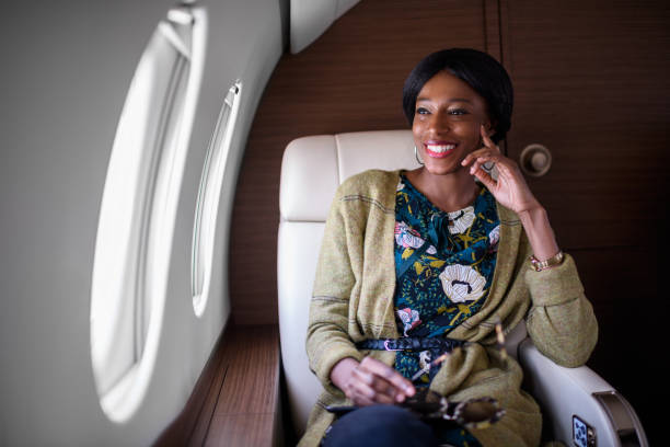 istock Woman in private jet airplane 903313280