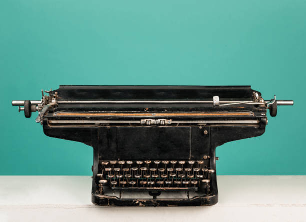 istock Retro old typewriter with paper on wooden table 903317106