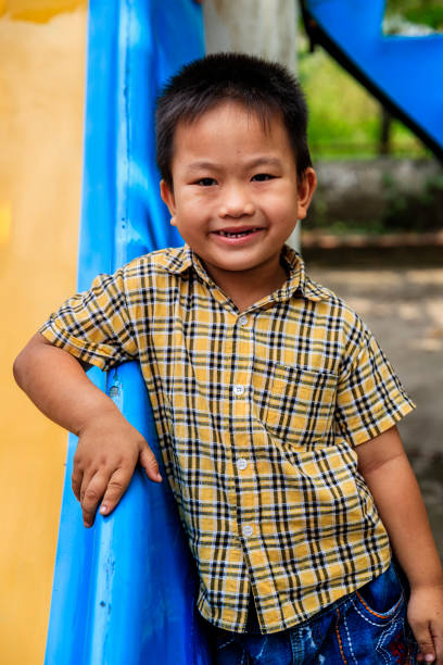 istock Vietnamese little boy having fun on slide, South Vietnam 903317460
