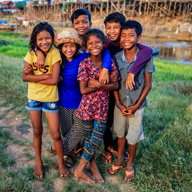 Group of happy Cambodian children, Cambodia Group of happy Cambodian children near Tonle Sap, Cambodia cambodian ethnicity stock pictures, royalty-free photos & images