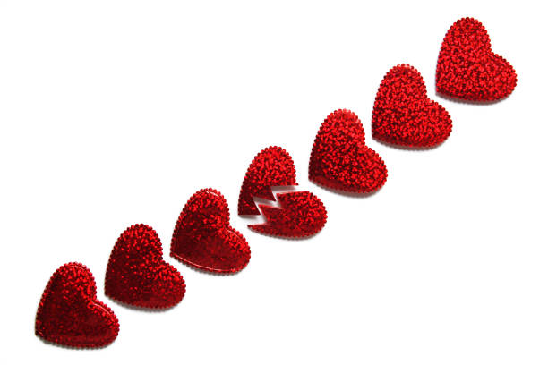 istock Red shiny hearts isolated on white background.Copy Space for your text or for graphic design.Top view.Concept for love and relationships,Saint Valentine's day,break up,divorce and heart health. 903322406