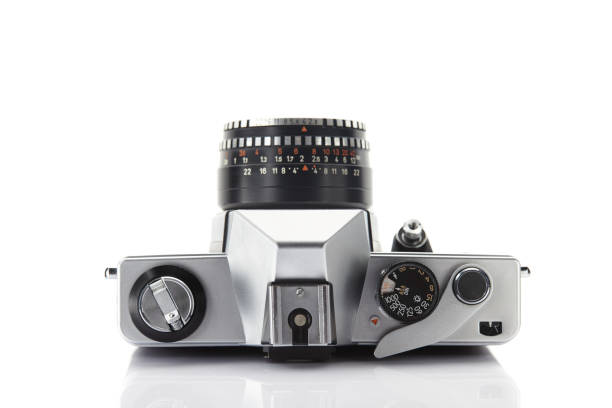 istock Old vintage film camera with lens isolated on white background 903323648
