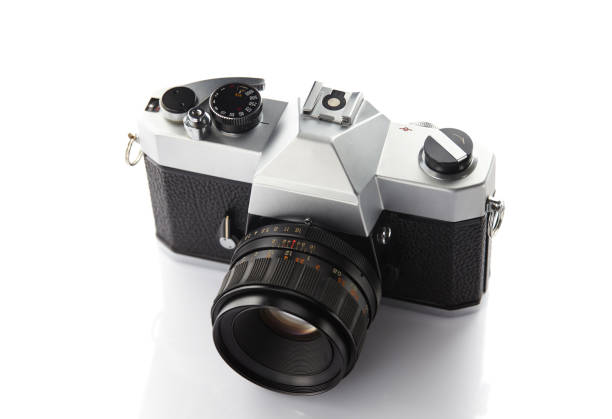 istock Old vintage film camera with lens on white background 903323706