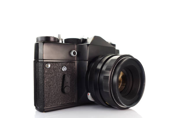 istock Vintage film camera with lens on white background 903323778